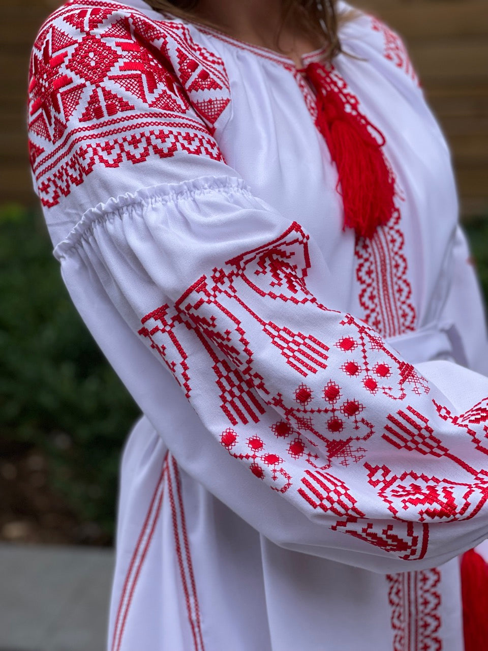 The White Dress with Red Embroidery