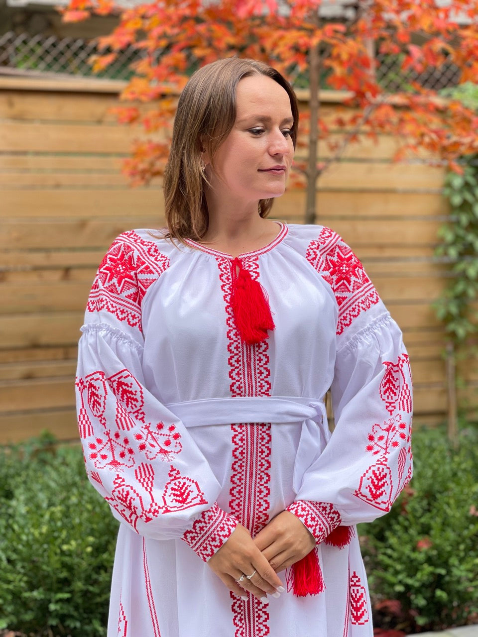 The White Dress with Red Embroidery