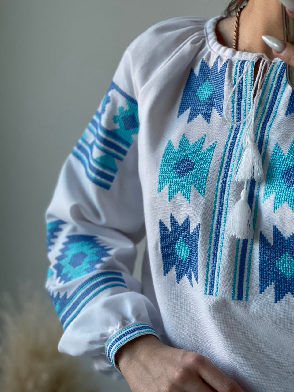 The White Women's Blouse with Blue Embroidery