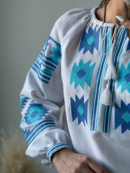 The White Women's Blouse with Blue Embroidery