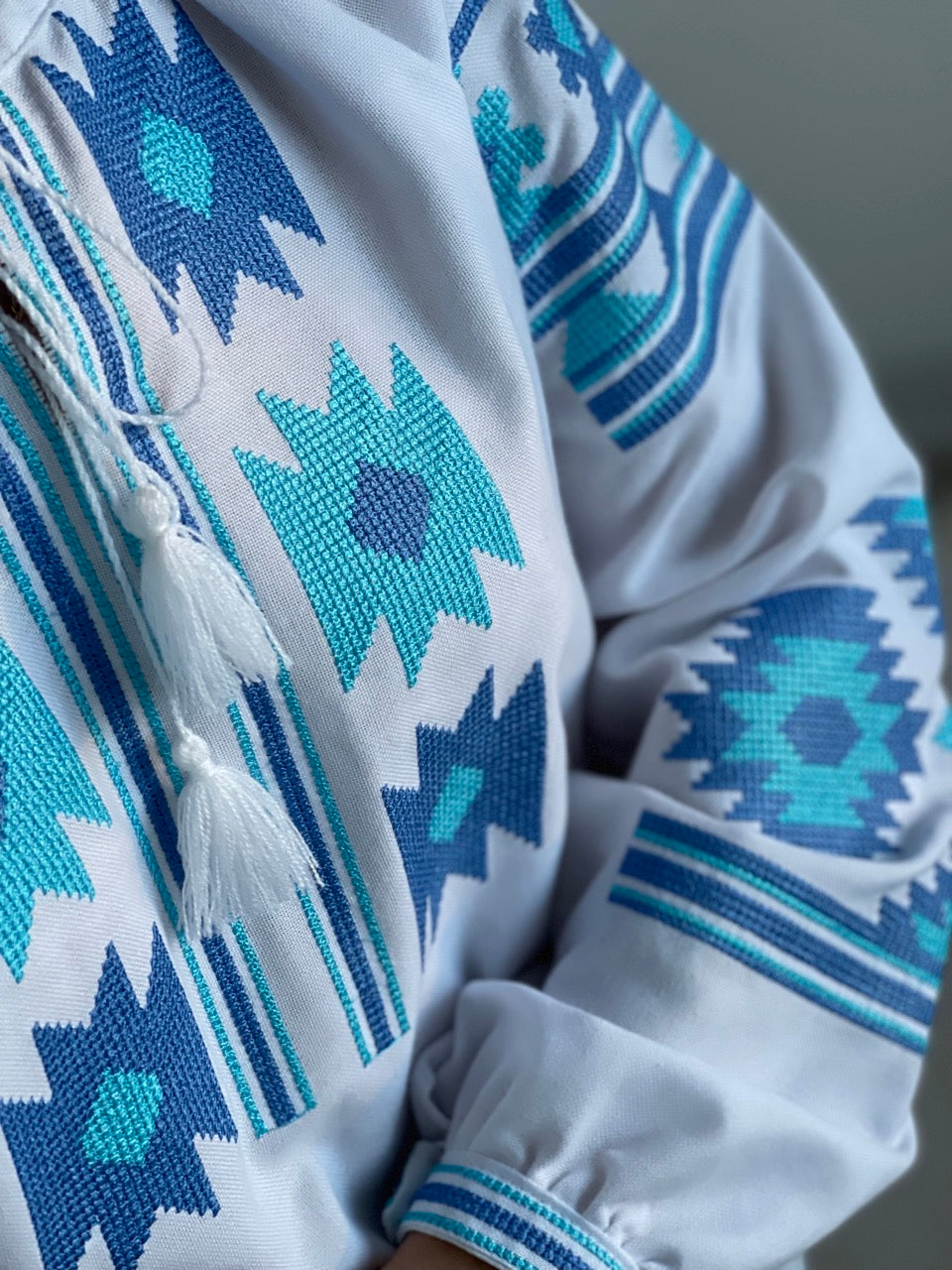 The White Women's Blouse with Blue Embroidery