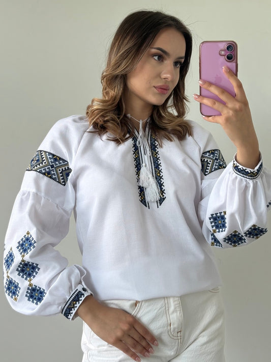 White Blouse with Blue Traditional-Style Embroidery