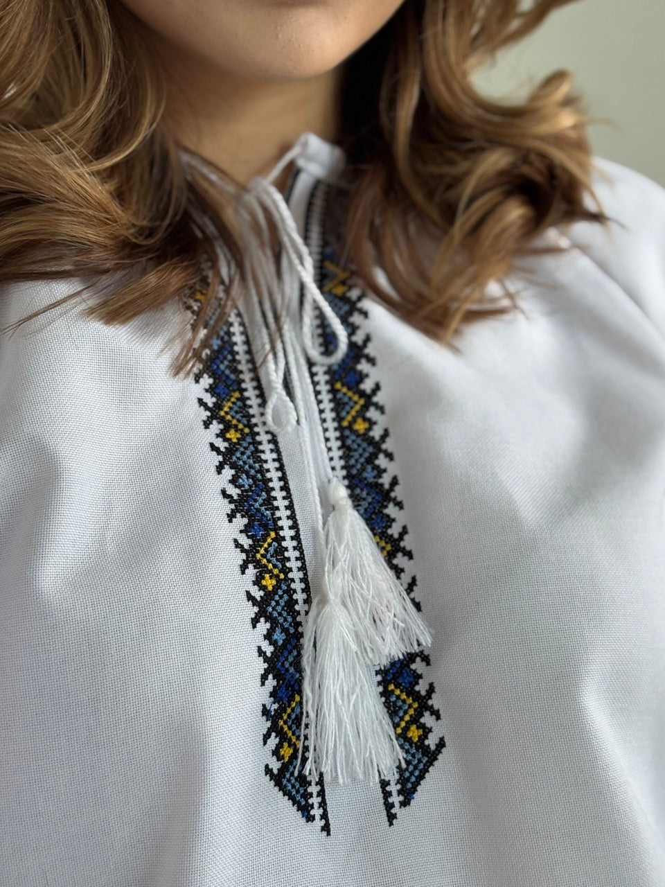White Blouse with Blue Traditional-Style Embroidery