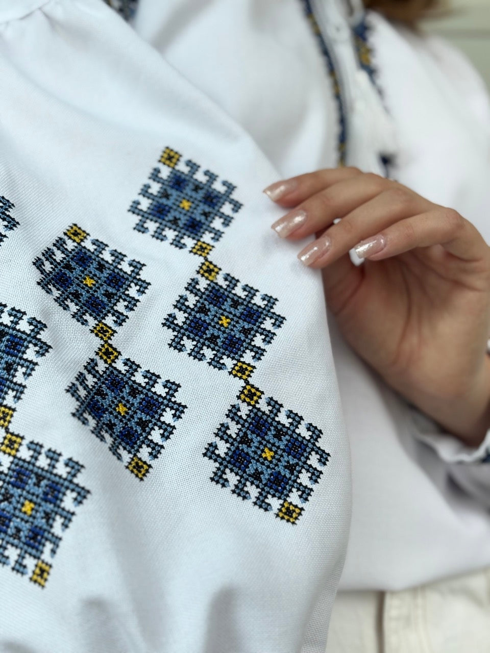 White Blouse with Blue Traditional-Style Embroidery