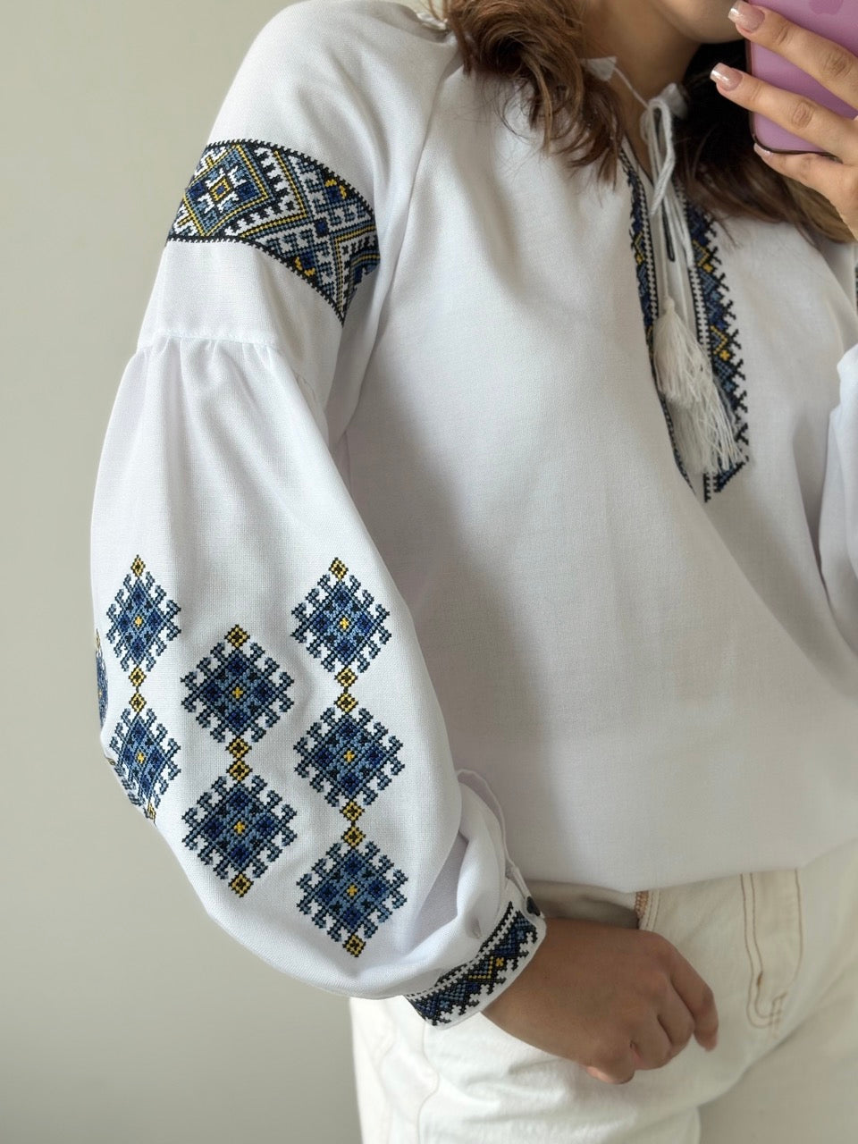 White Blouse with Blue Traditional-Style Embroidery