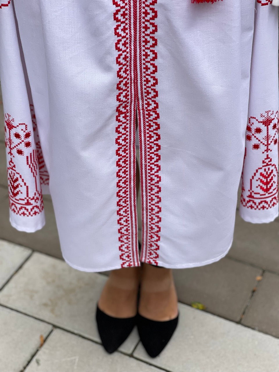 The White Dress with Red Embroidery