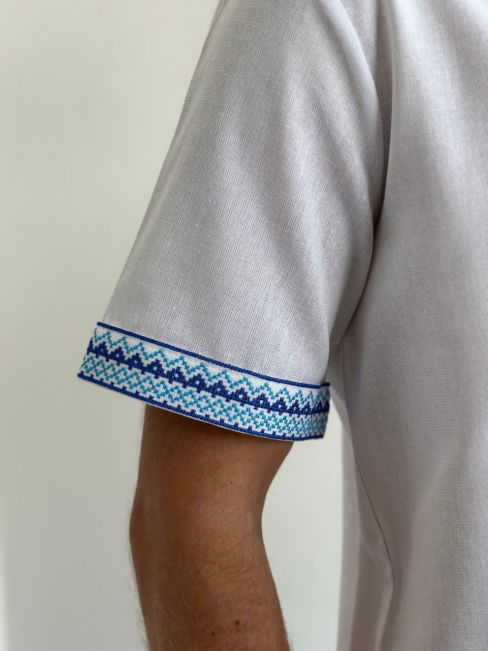 White Men's Vyshyvanka with Short Sleeves and Blue Embroidery