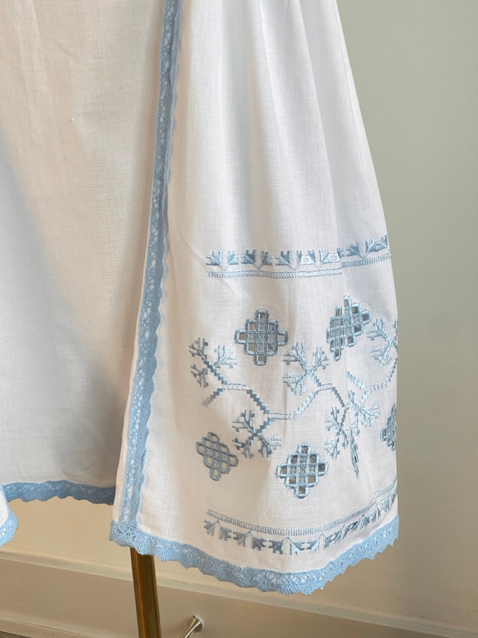 The White Dress with Blue Embroidery