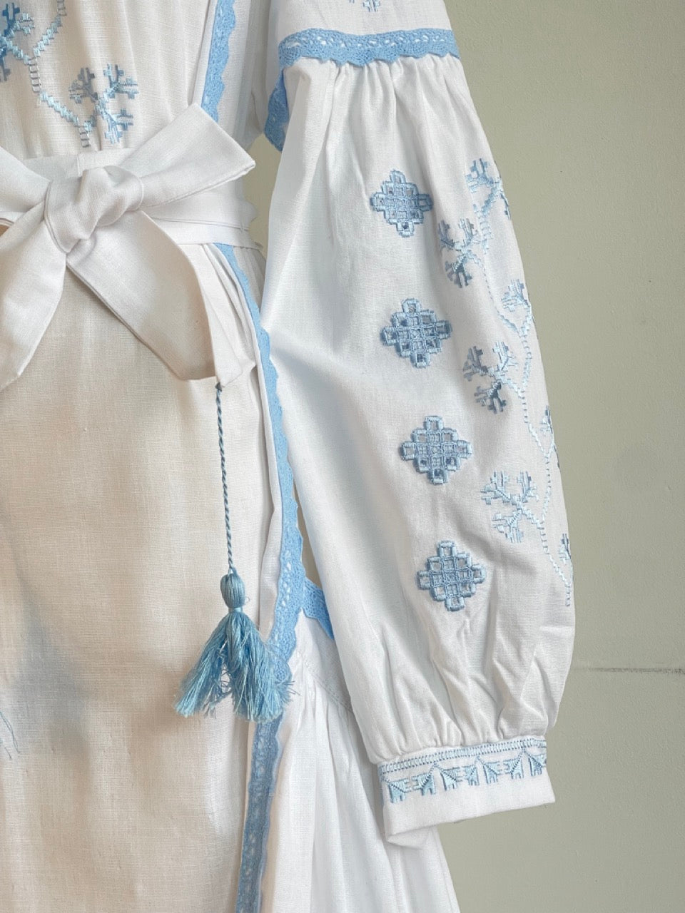 The White Dress with Blue Embroidery