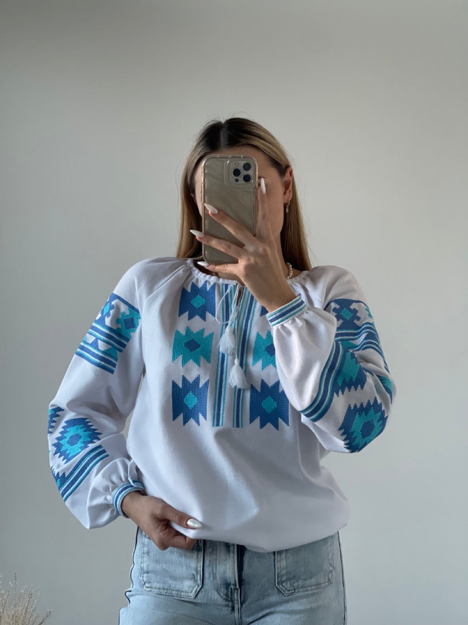 The White Women's Blouse with Blue Embroidery