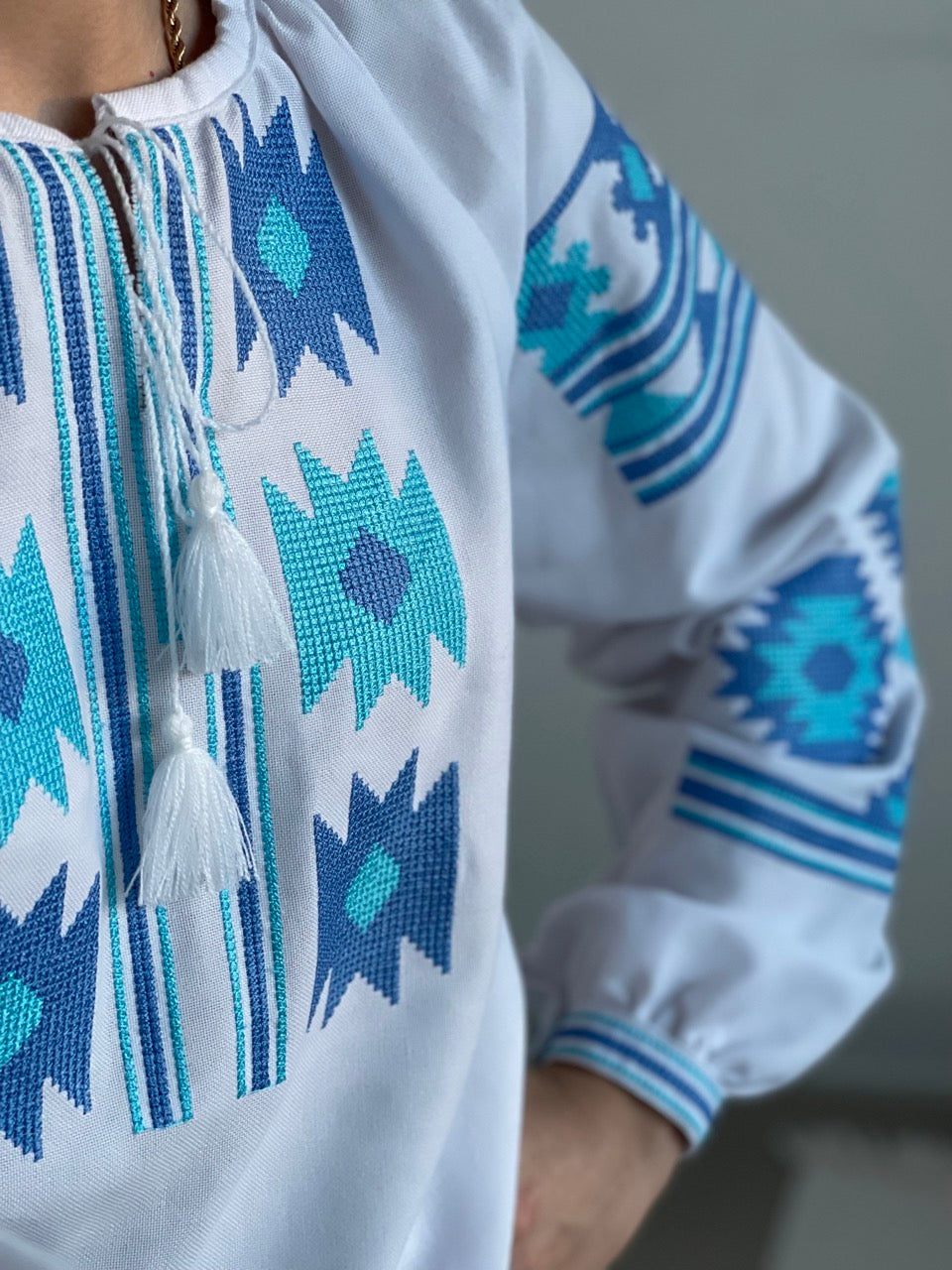 The White Women's Blouse with Blue Embroidery