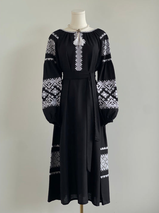 The Black Dress with White Embroidery