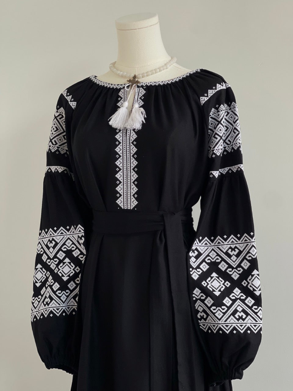 The Black Dress with White Embroidery