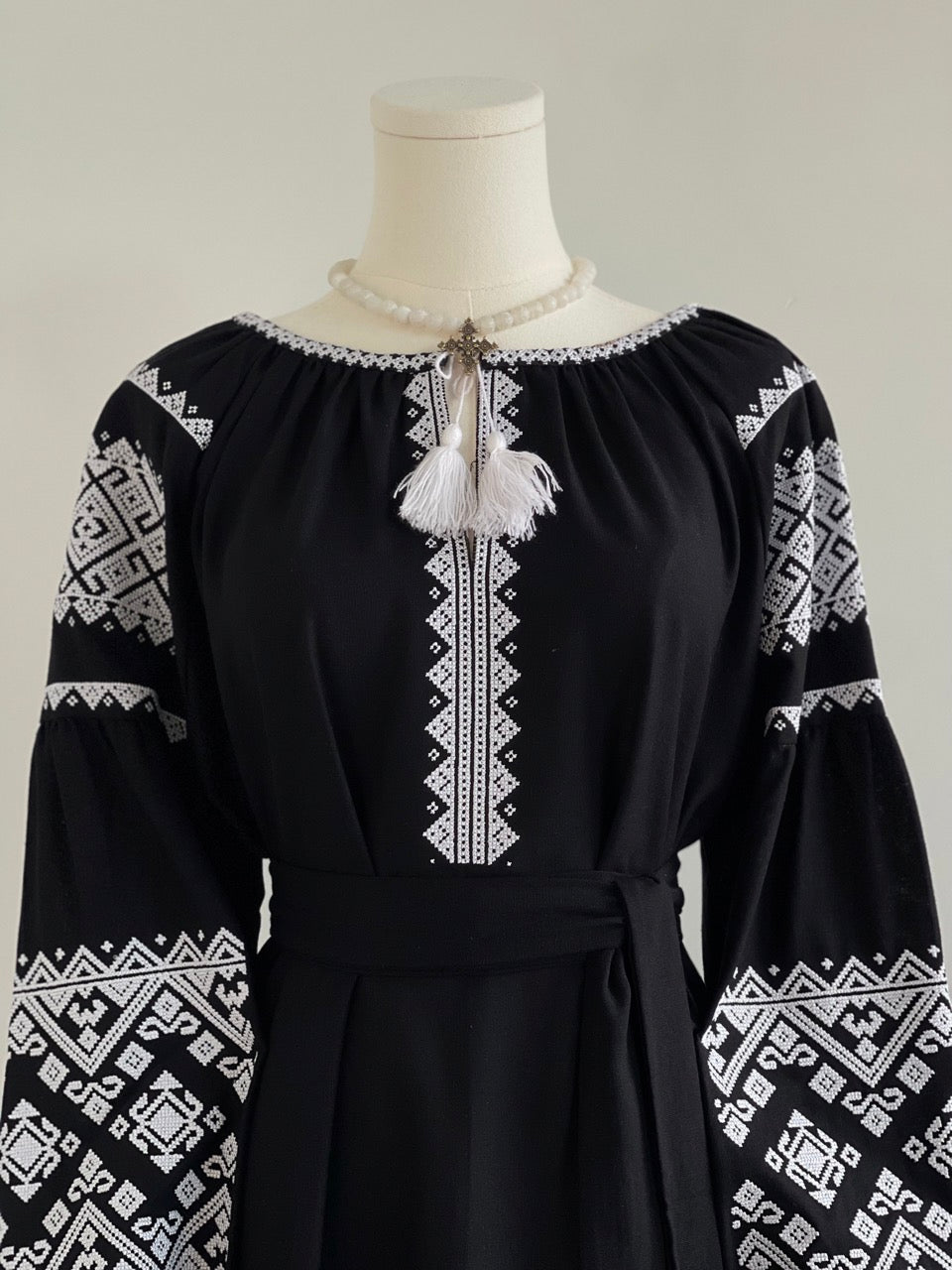 The Black Dress with White Embroidery