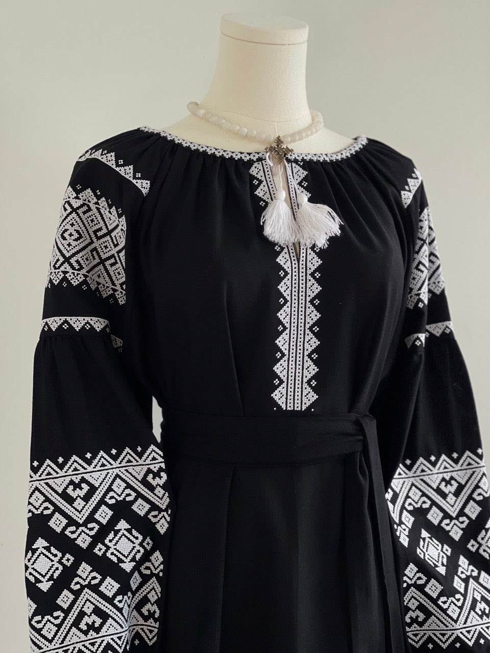 The Black Dress with White Embroidery